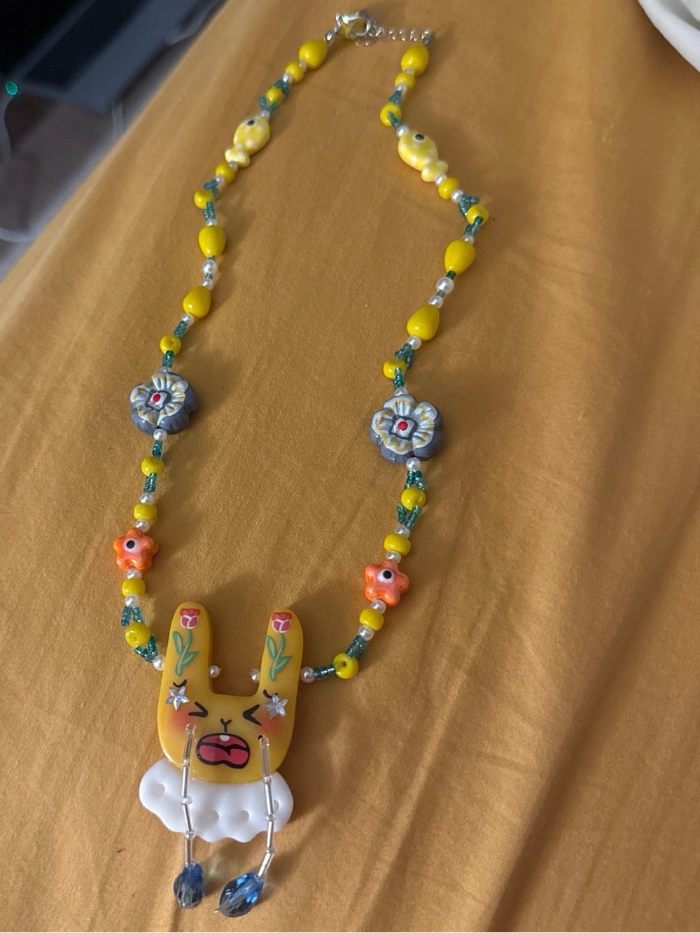 Whimsy Sad Bunny Beaded Necklace with Blue and Yellow Accent Charms